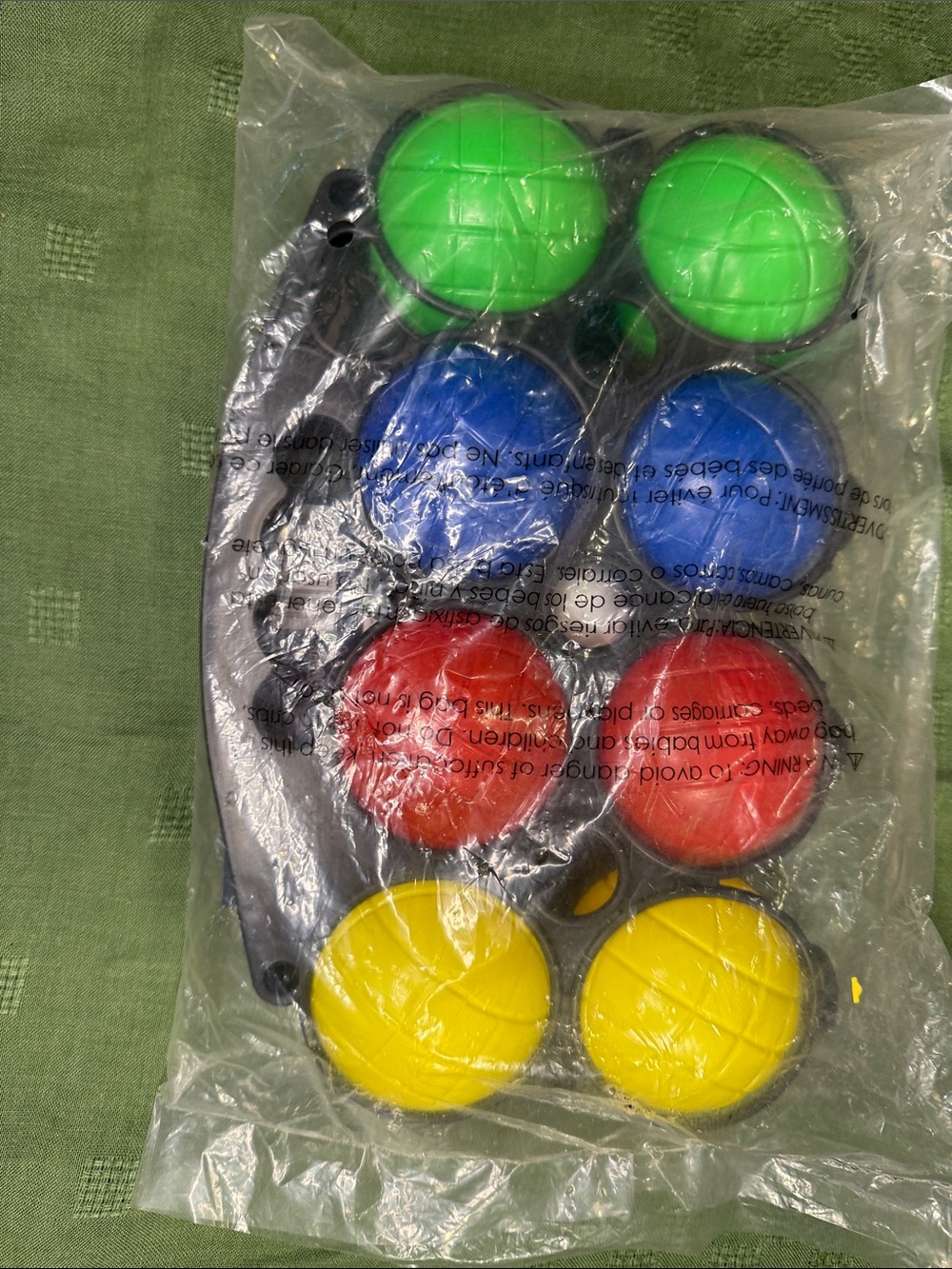 piece colorful plastic bocce ball set packaged in a black plastic carry rack